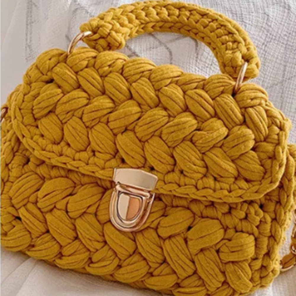 Crotchet Woven top handle bag in Mustard. 
Push lock clasp and long strap .NWT